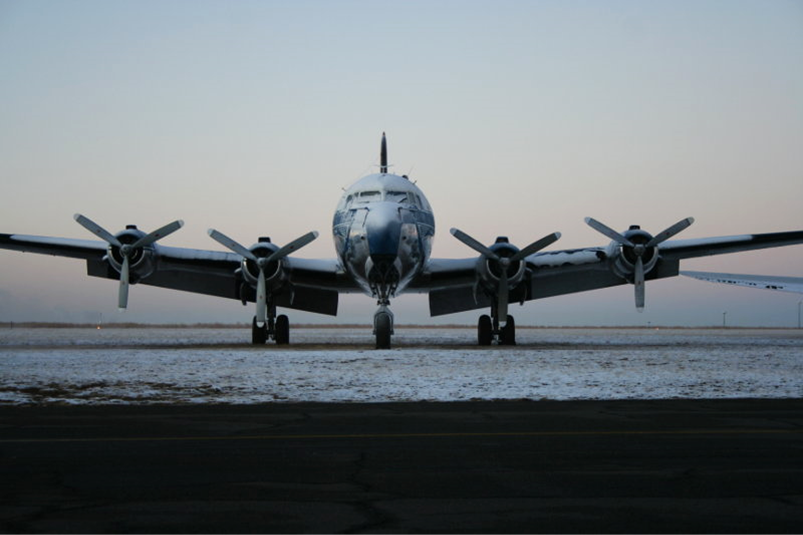 A plane sitting on top of a runway

Description automatically generated