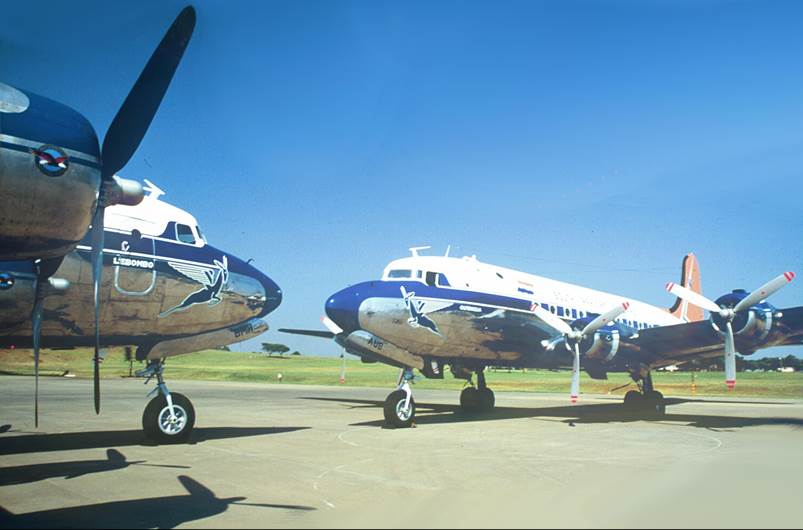 A couple of airplanes on a runway

Description automatically generated