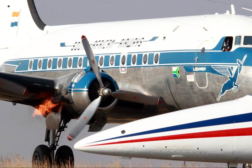 A large passenger jet sitting on top of a runway

Description automatically generated