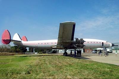 A large airplane parked on the ground

Description automatically generated