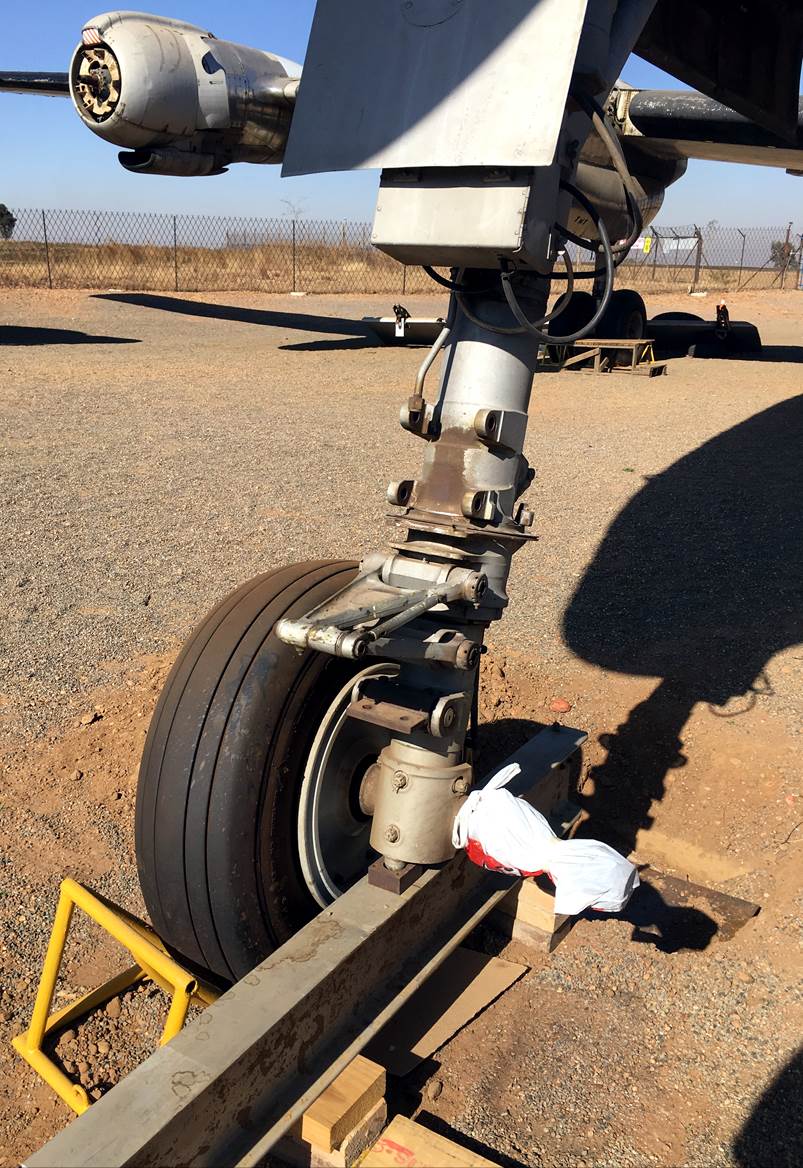 A wheel with a machine on it

Description automatically generated