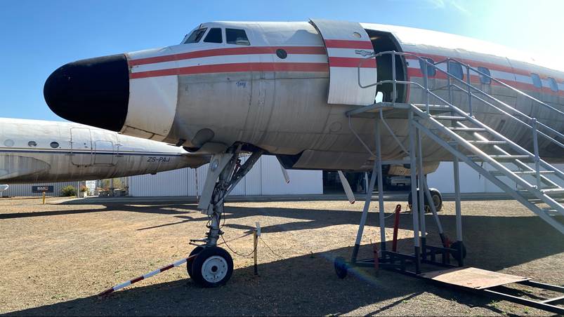 An airplane on display in a field

Description automatically generated