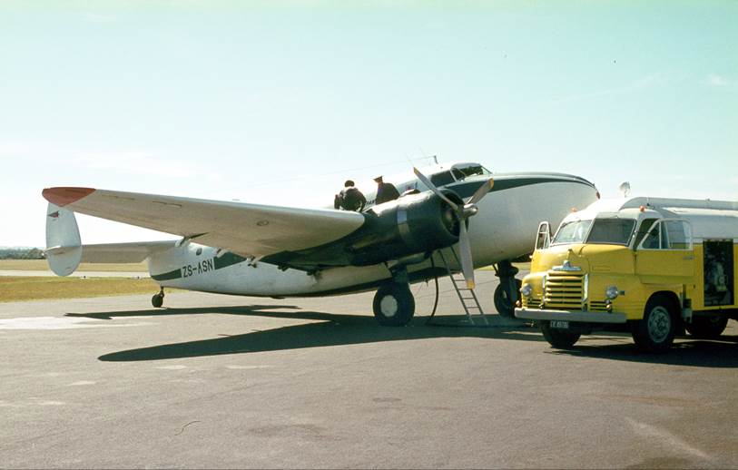 A plane parked on the tarmac

Description automatically generated