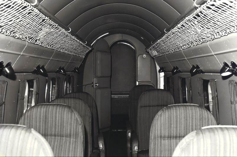 The inside of an airplane with seats

Description automatically generated