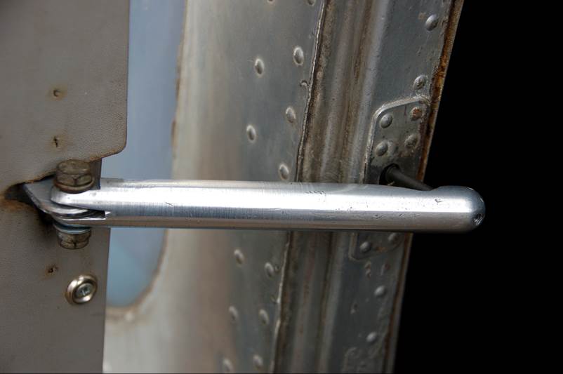 Close-up of a metal door handle

Description automatically generated