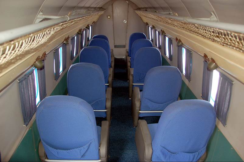 A plane with blue seats

Description automatically generated