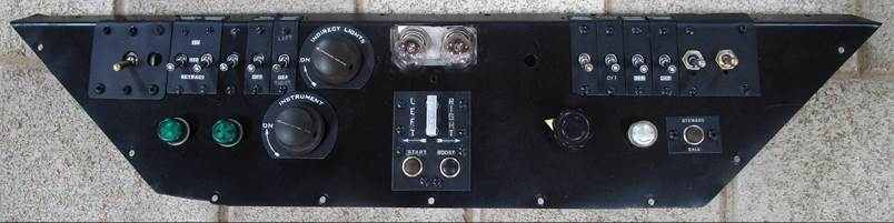 A black rectangular object with buttons and screws

Description automatically generated