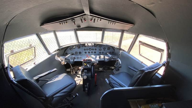 Inside a cockpit of a plane

Description automatically generated