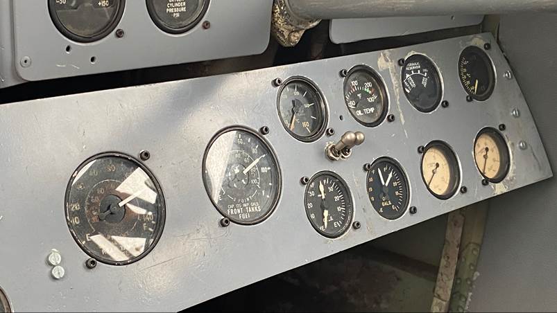 A close-up of a panel of gauges

Description automatically generated