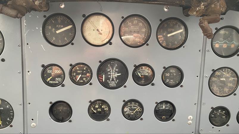 A close-up of a panel of gauges

Description automatically generated