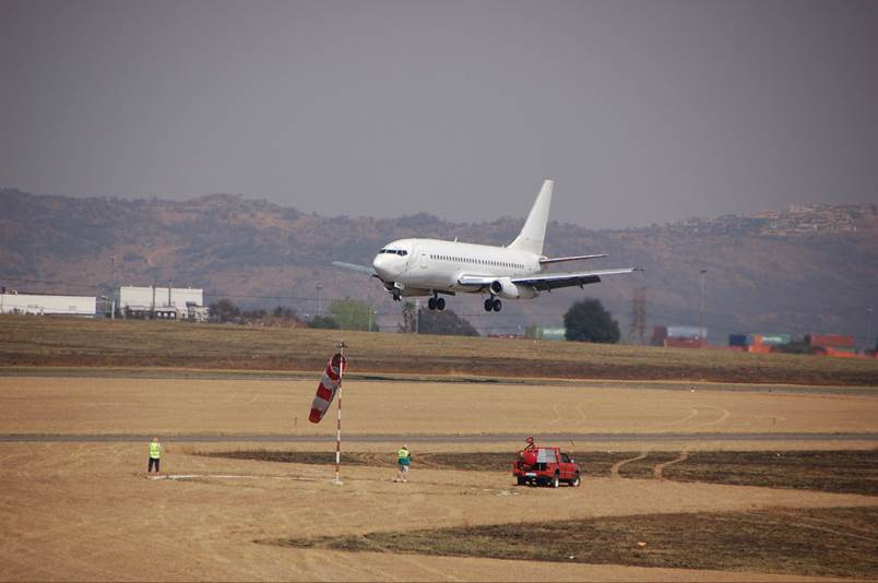 A fighter jet sitting on top of a runway

Description automatically generated