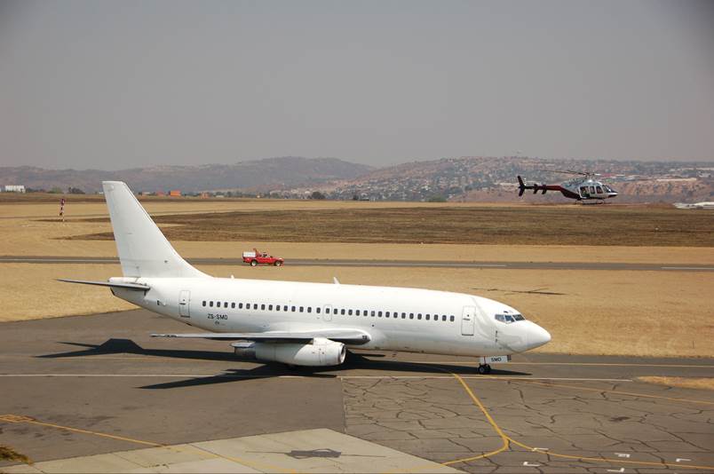 A plane sitting on top of a runway

Description automatically generated