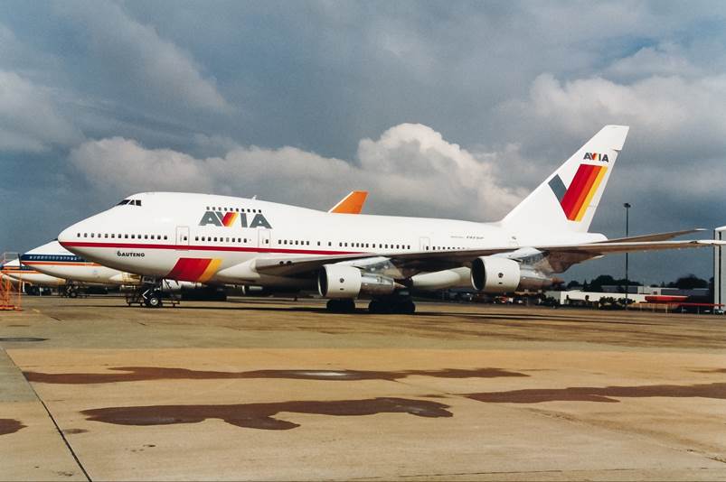 A large white airplane on a runway

Description automatically generated