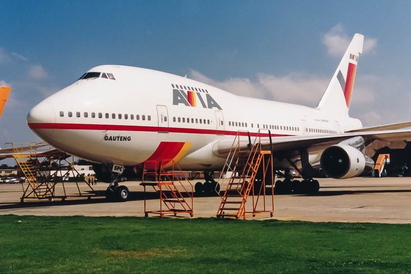 A large passenger jet sitting on top of a runway

Description automatically generated