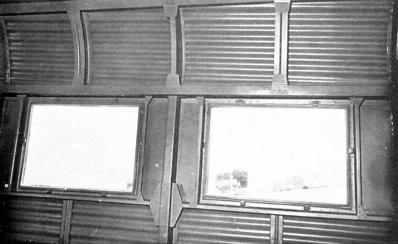 A black and white photo of a window

Description automatically generated