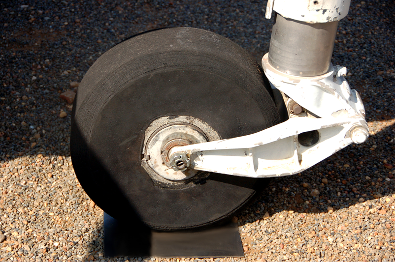 A wheel on a metal stand

Description automatically generated