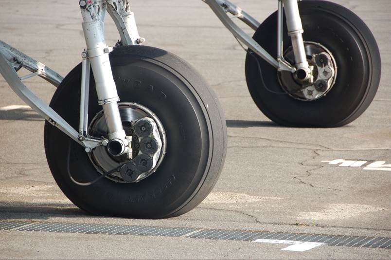 Close-up of a plane's front wheels

Description automatically generated